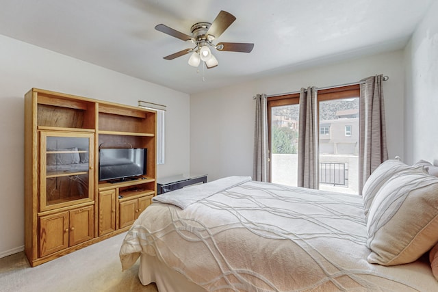 bedroom with light carpet, ceiling fan, and access to outside