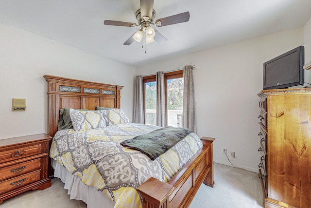 bedroom with ceiling fan and light carpet