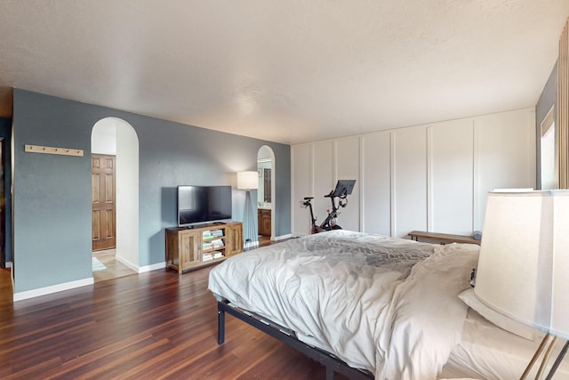 bedroom featuring dark wood-type flooring