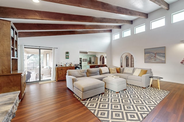 living room featuring dark wood-type flooring and beam ceiling