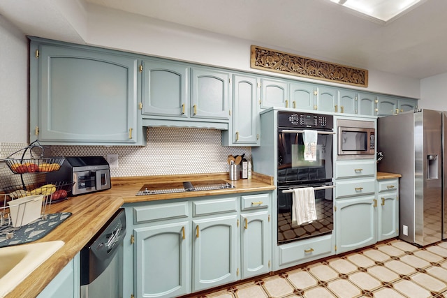 kitchen with backsplash, sink, and black appliances