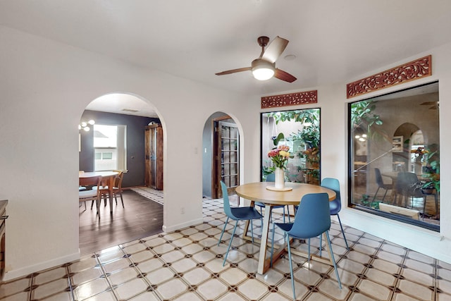 dining room featuring ceiling fan and a healthy amount of sunlight