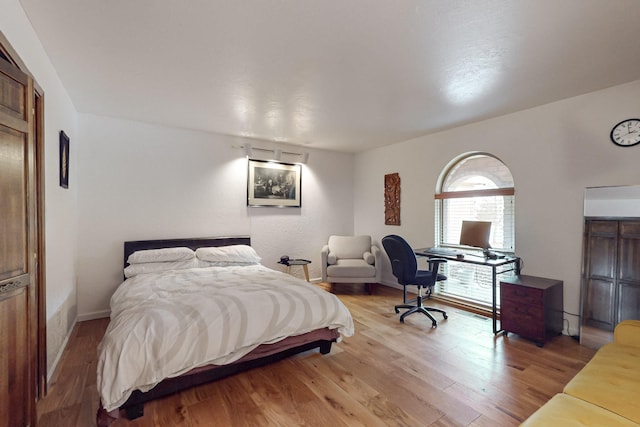 bedroom featuring wood-type flooring