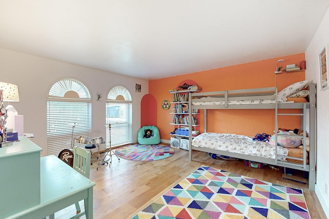 bedroom with hardwood / wood-style flooring