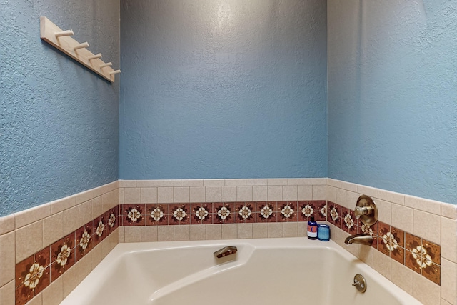 bathroom featuring a washtub