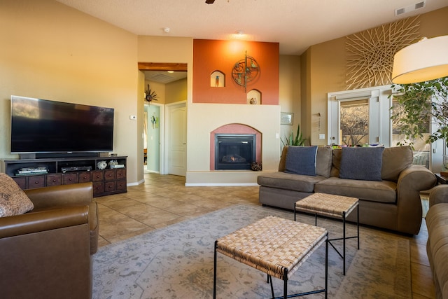 tiled living room featuring a high ceiling