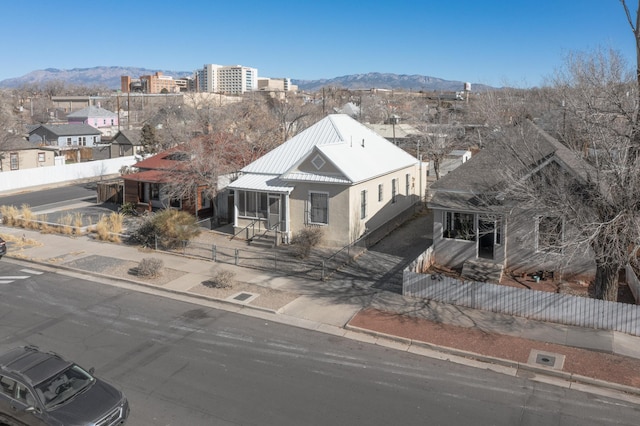 birds eye view of property featuring a mountain view