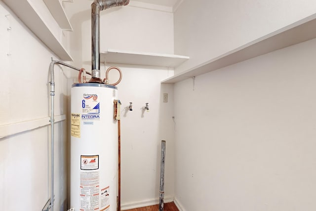 utility room featuring water heater