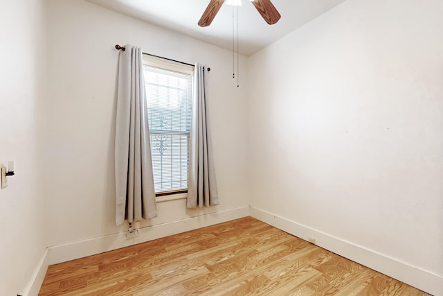 empty room featuring ceiling fan and light hardwood / wood-style flooring