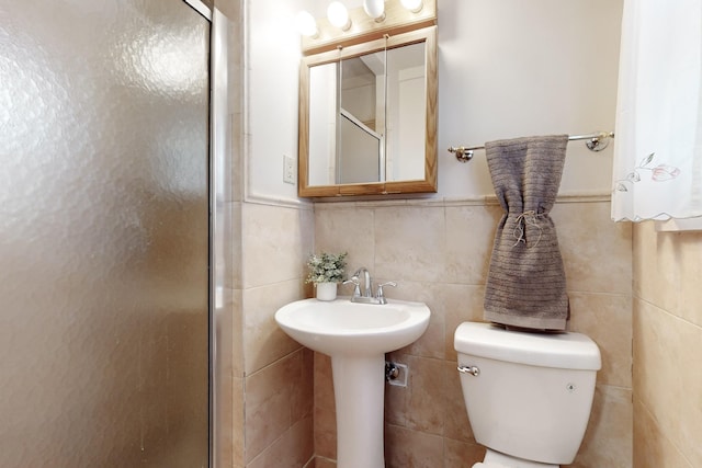 bathroom with toilet and walk in shower