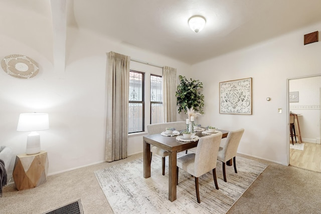 dining area with light carpet