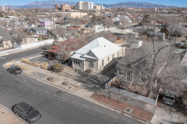 birds eye view of property featuring a mountain view