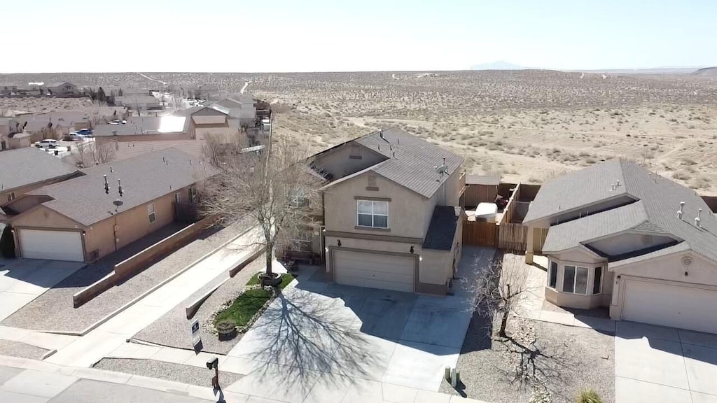 bird's eye view featuring view of desert and a residential view