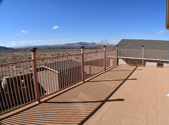 balcony featuring a mountain view