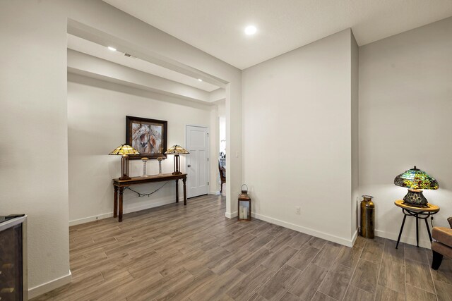 carpeted bedroom featuring ceiling fan and a tray ceiling