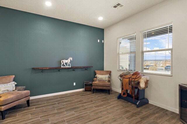 carpeted bedroom featuring ceiling fan and a raised ceiling