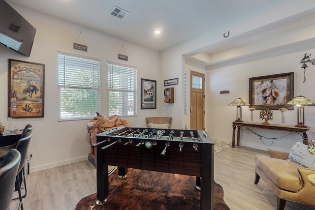 carpeted bedroom featuring ceiling fan and a tray ceiling