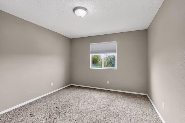 6704 Nueva Piedra St NW, Albuquerque, NM 87120 - spare room with carpet floors, a textured ceiling, and baseboards