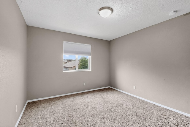 6704 Nueva Piedra St NW, Albuquerque, NM 87120 - unfurnished room with carpet, a smoke detector, baseboards, and a textured ceiling