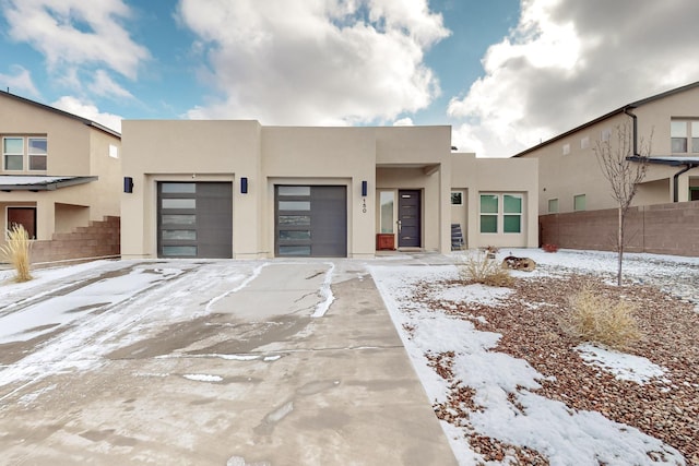 southwest-style home featuring a garage