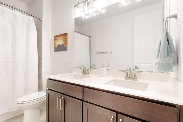 bathroom with a shower with curtain, vanity, and toilet