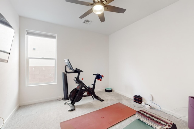 exercise area with light carpet and ceiling fan