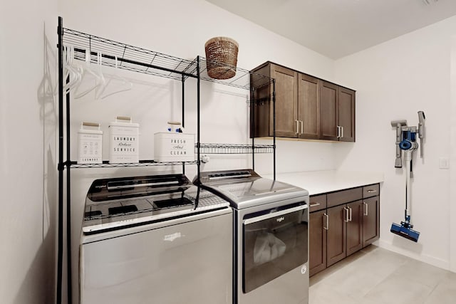 laundry area featuring cabinets and independent washer and dryer