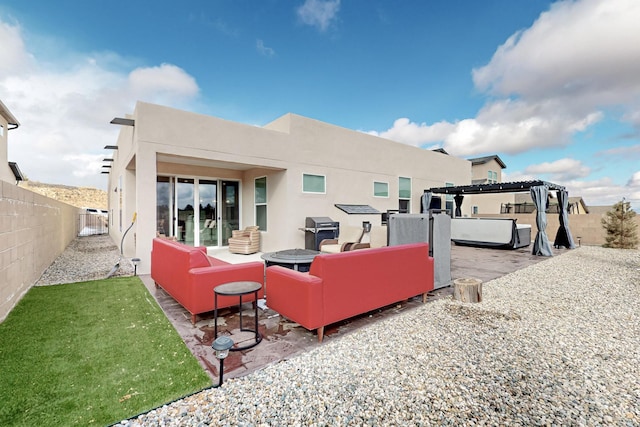 rear view of house with an outdoor living space, a pergola, and a patio