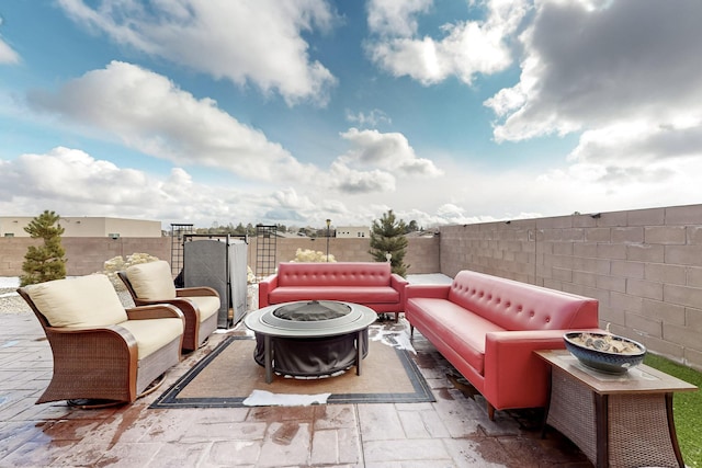 view of patio / terrace with an outdoor living space with a fire pit