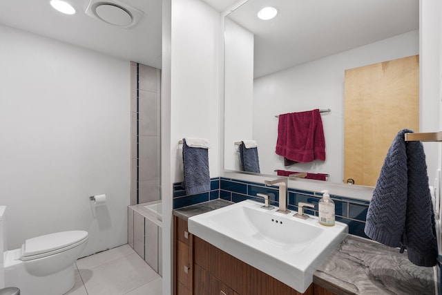 bathroom with tile patterned floors, vanity, and toilet