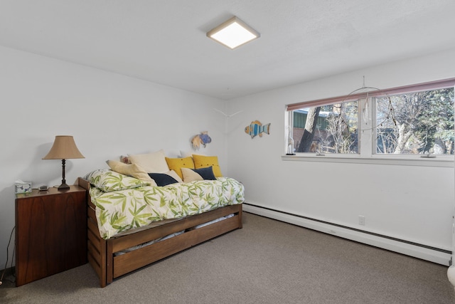 bedroom featuring carpet and a baseboard heating unit