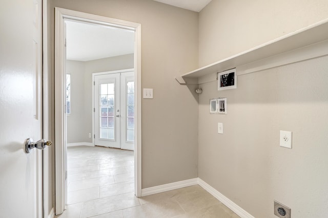 laundry room featuring french doors, washer hookup, hookup for an electric dryer, and light tile patterned floors