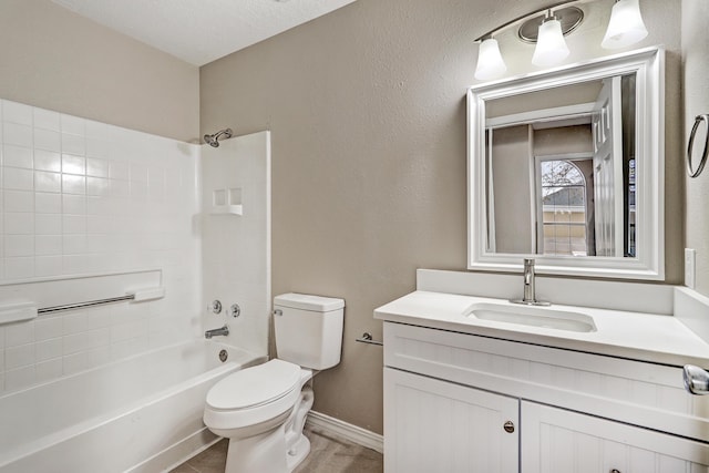 full bathroom featuring vanity, a textured ceiling, bathing tub / shower combination, and toilet