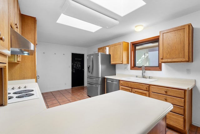 kitchen featuring appliances with stainless steel finishes, extractor fan, sink, kitchen peninsula, and light tile patterned floors