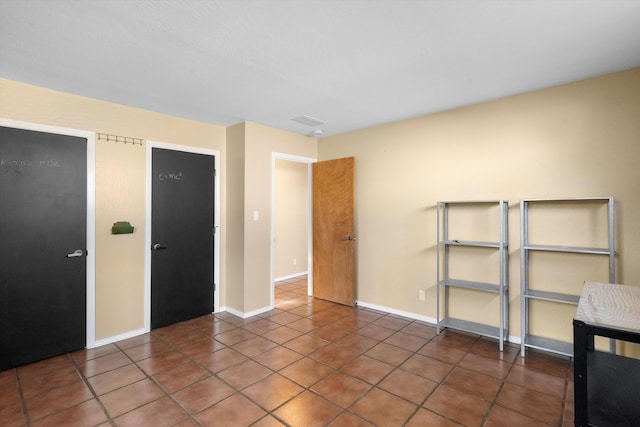 view of tiled spare room