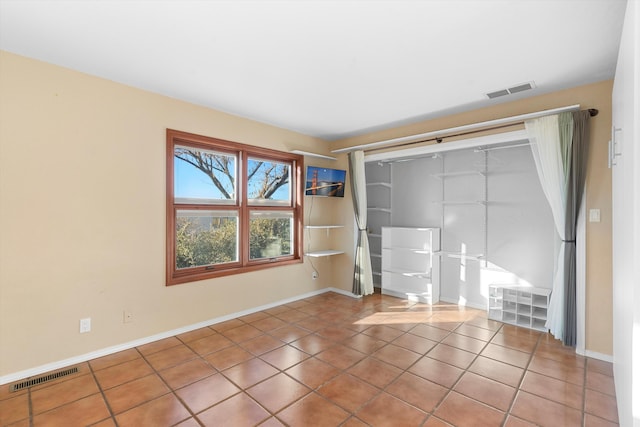 empty room featuring tile patterned flooring