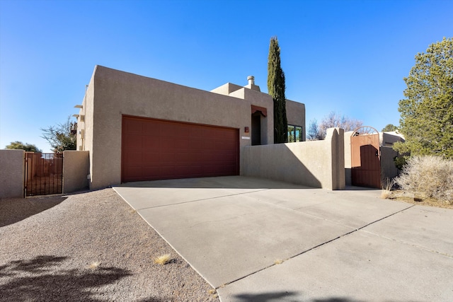 southwest-style home featuring a garage