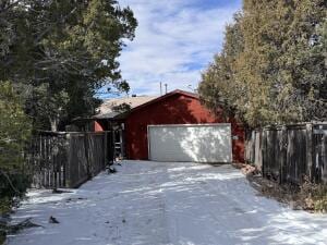 view of snow covered garage