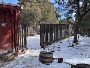 view of yard layered in snow