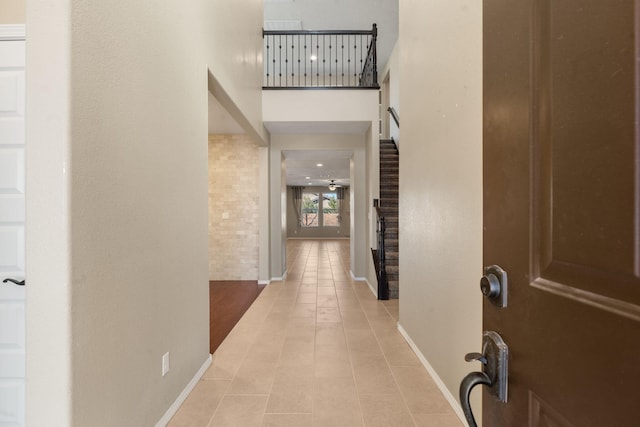 hallway featuring light tile patterned flooring