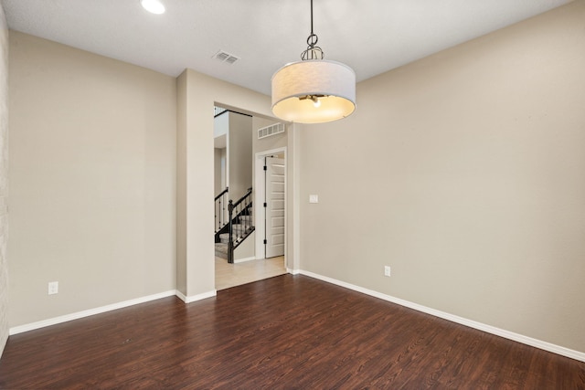 empty room featuring hardwood / wood-style flooring