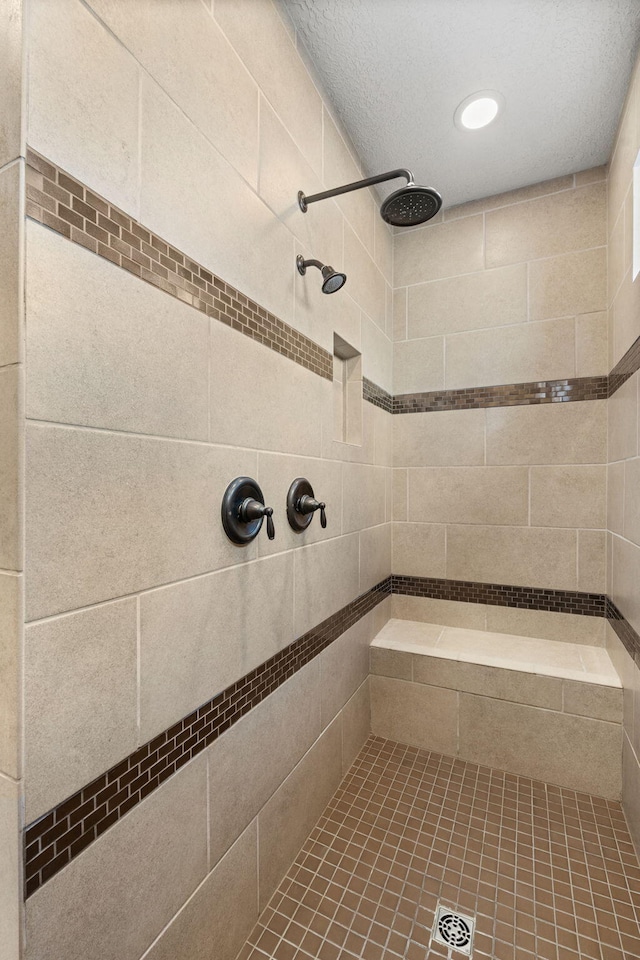 bathroom with tiled shower