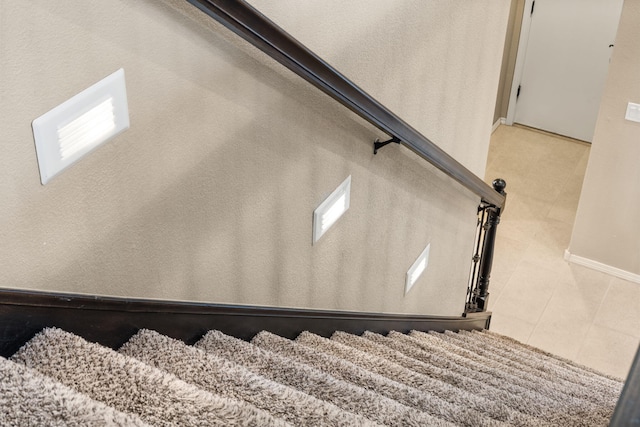 staircase with tile patterned flooring