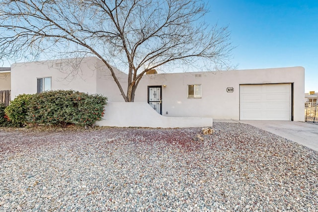 southwest-style home with a garage