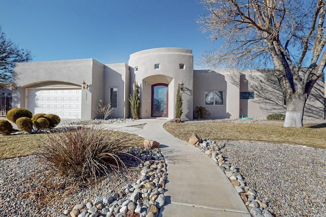 southwest-style home with a garage