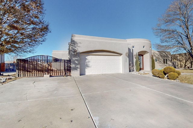 adobe home featuring a garage