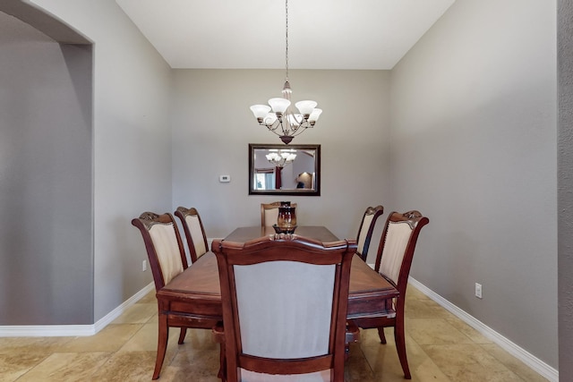 dining room with a notable chandelier