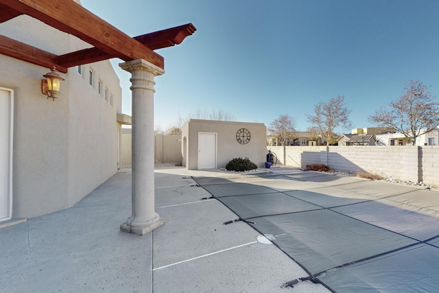 view of patio with an outdoor structure