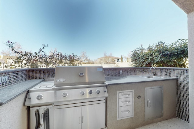 view of patio / terrace with exterior kitchen and sink