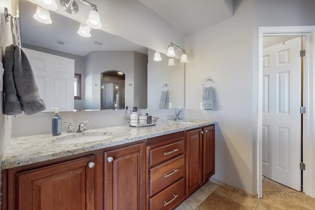 bathroom with tile patterned floors and vanity